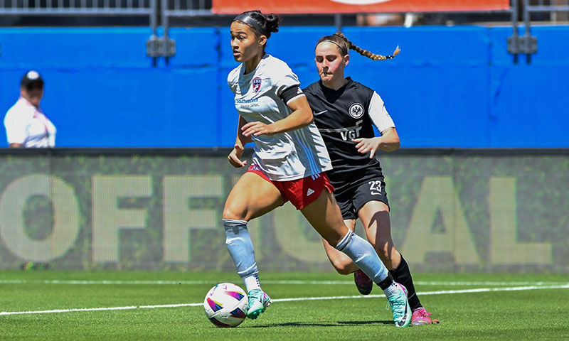 Young girl playing soccer