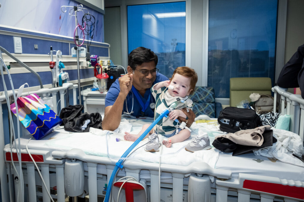 Dr. Suren Reddy (MD, Cardiology) with patient and family.